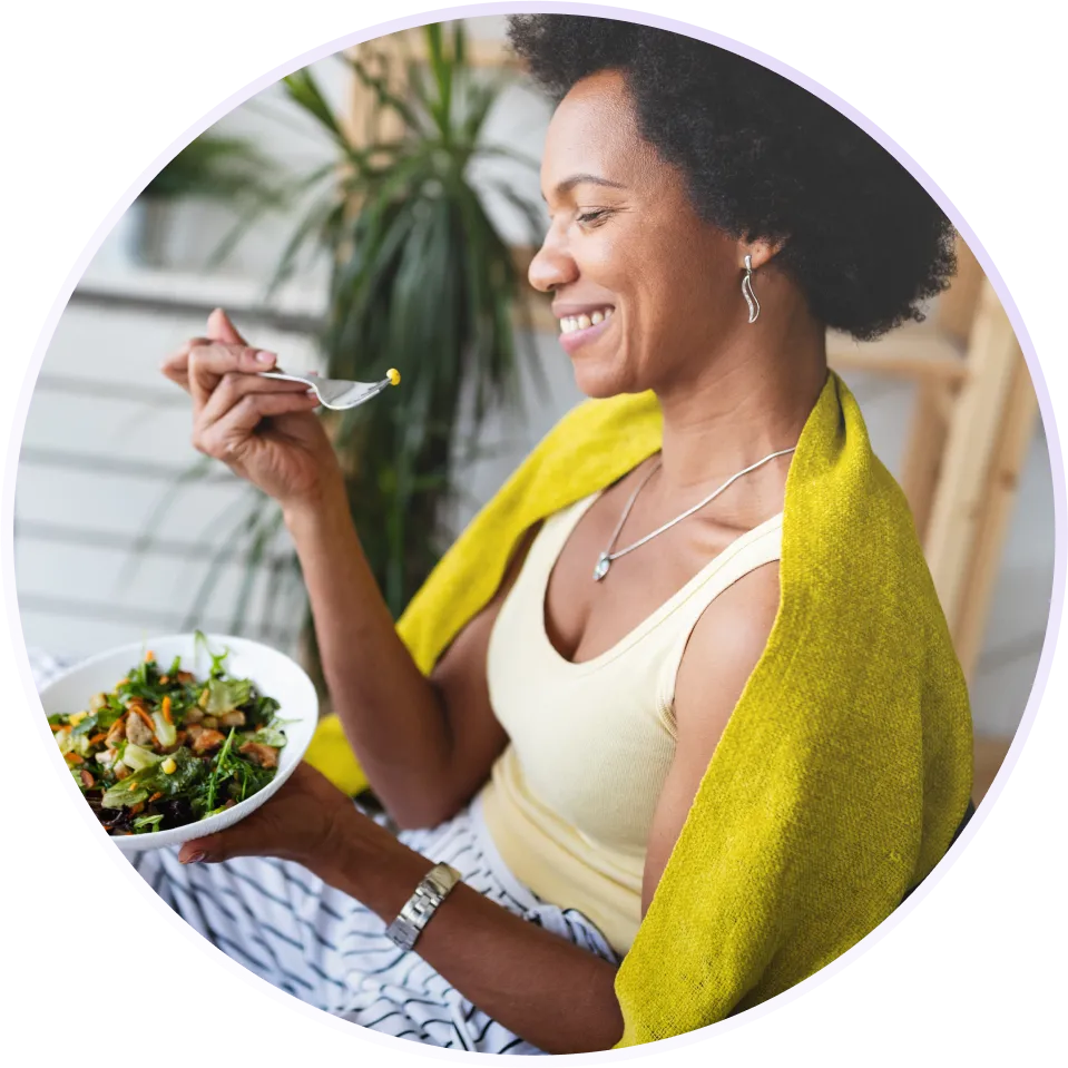 a woman eating a salad